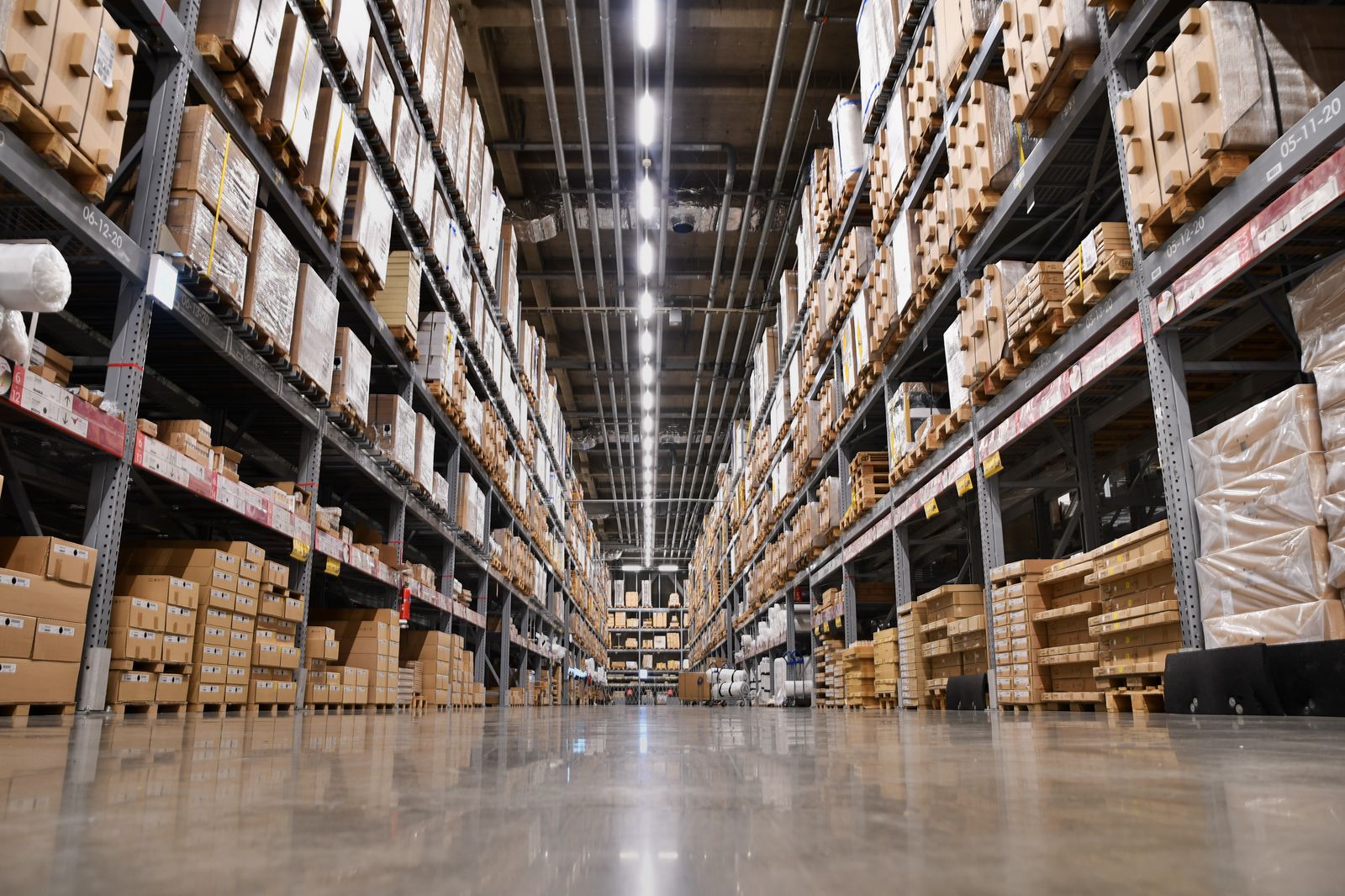 Warehouse aisle with stocked racks